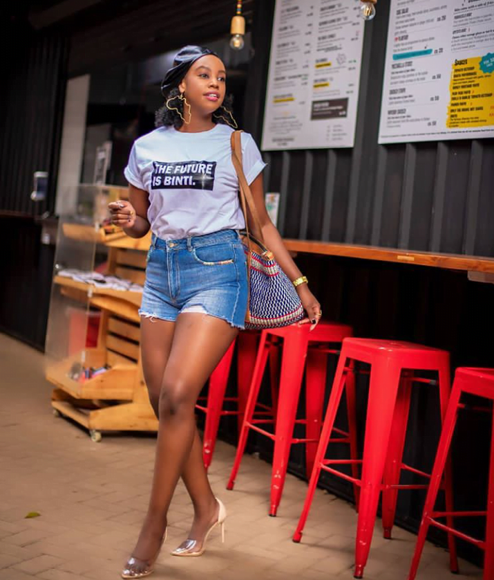 Kenyan women in High waist blue denim shorts